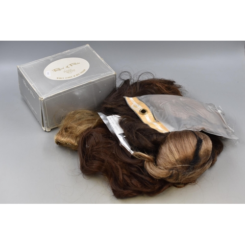 556 - A Large Selection of Wigs and Hair Extensions, Includes Rene of Paris.