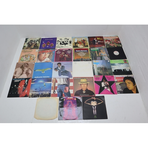 587 - A Selection of Vinyl LP's To Include Bruce Springsteen, A Star is Born, Elvis and More. Includes Som... 