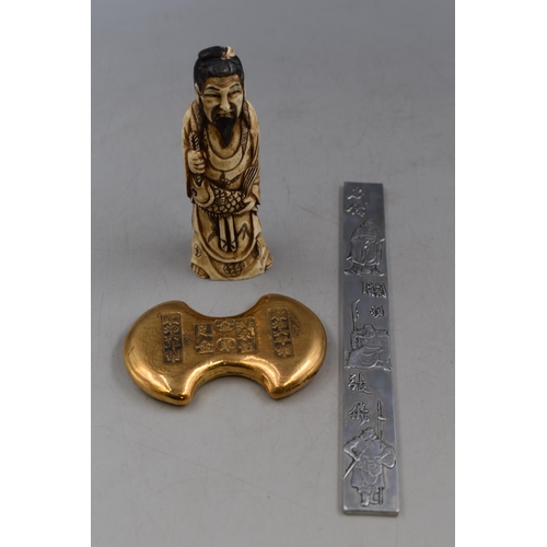 257 - Replica of a Ming Dynasty Gold Ingot, Plated Ware Scroll Book Mark and a traditional Figurine