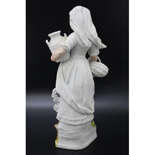 304 - A German Bisque Figure of Woman Holding Jug and Basket, Marked 12230 To The Back. Approx 15