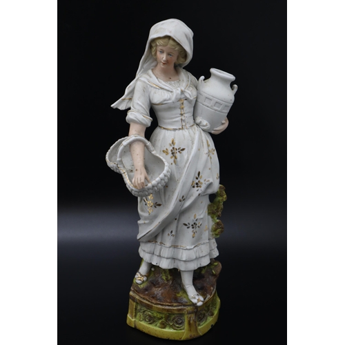 304 - A German Bisque Figure of Woman Holding Jug and Basket, Marked 12230 To The Back. Approx 15