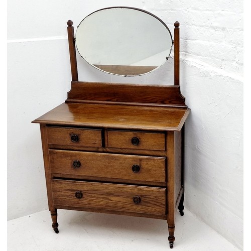 569 - Vintage Chest of 4 Drawers 2 over 2 with Oval Mirrored Top which is removable. Stands on wheeled leg... 