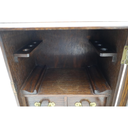 277 - A Glass Door Wooden Smokers Cabinet, With Key, Two Drawers And Ciger Holders. Approx 8