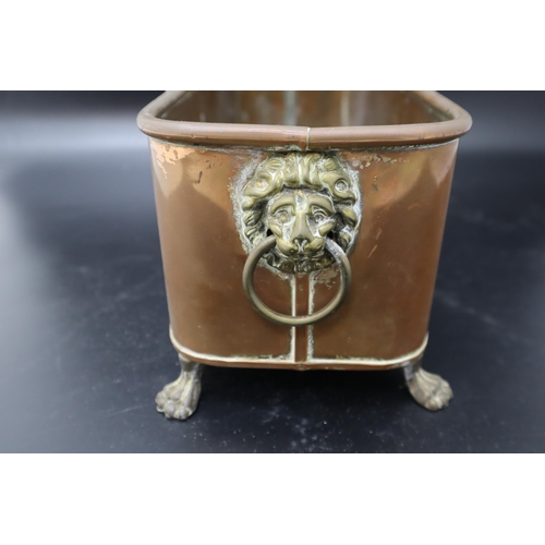 300 - A Copper Lion's Head Planter, On Four Feet. Approx 5.5