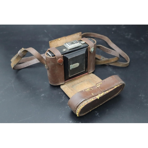 353 - A Dehel folding camera and case.