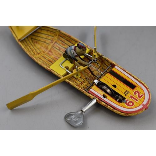 363 - Retro Tin Plate Wind Up Row Boat in Box with Key. By Faya 1905.