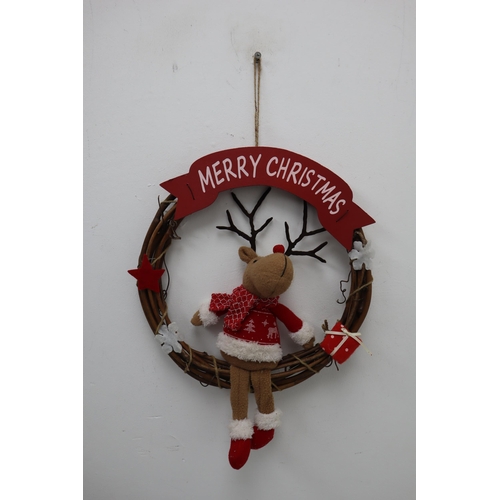 385 - A Selection of Assorted Christmas Decorations. Includes Tree, Wreaths, LED Santa Waving and More.