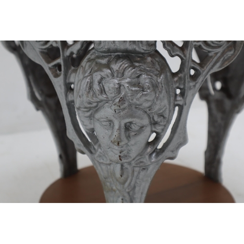 400 - A Wooden And Cast Iron Circular Conservatory Coffee Table, Depicting Classical Faces. Approx 21.5