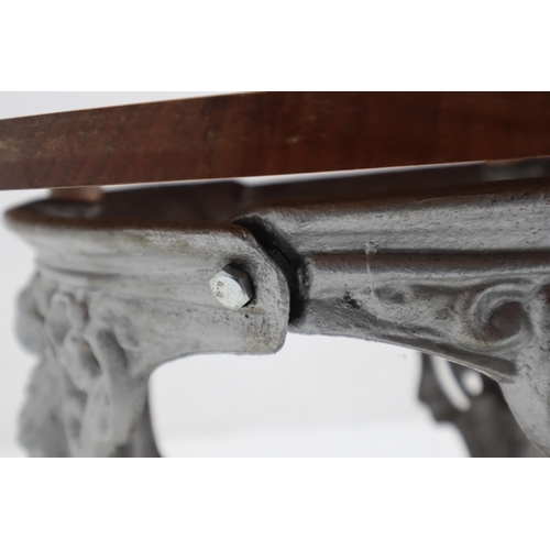 400 - A Wooden And Cast Iron Circular Conservatory Coffee Table, Depicting Classical Faces. Approx 21.5