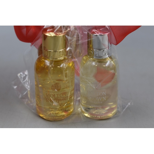 407 - A Molton Brown Gift Collection, Includes Rhubarb & Rose Hand Wash, Jubilant Pine & Patchouli Body Lo... 