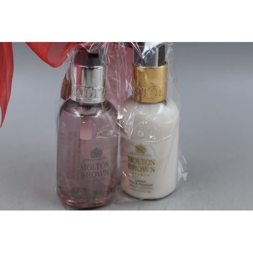 407 - A Molton Brown Gift Collection, Includes Rhubarb & Rose Hand Wash, Jubilant Pine & Patchouli Body Lo... 