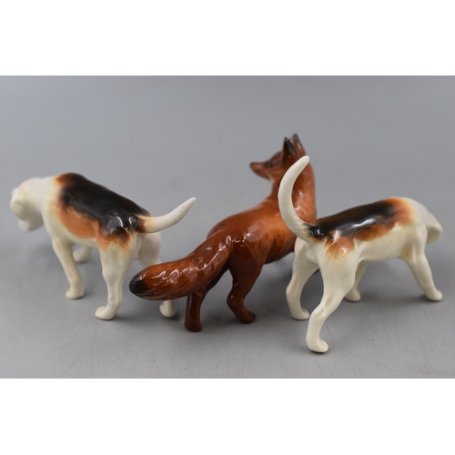 120 - Beswick Fox with two Hounds (Fox has damage to ear but Hounds are fine)