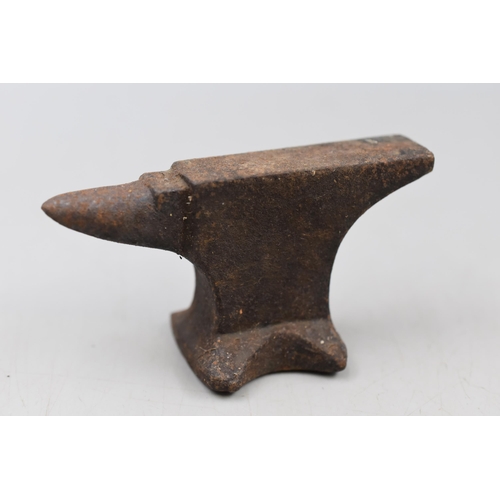 124 - Four vintage miniature Cast Iron Anvils