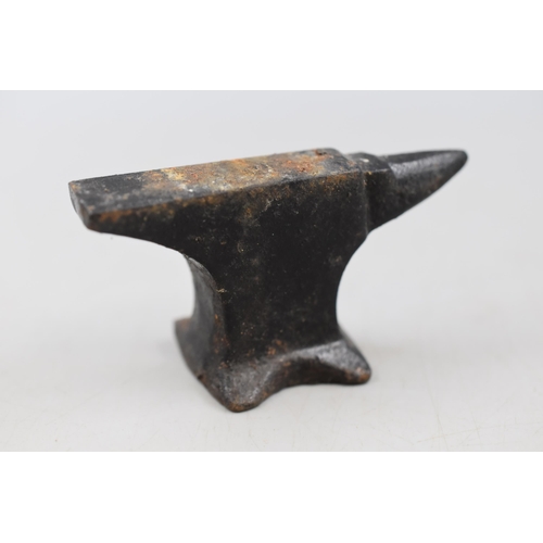 124 - Four vintage miniature Cast Iron Anvils