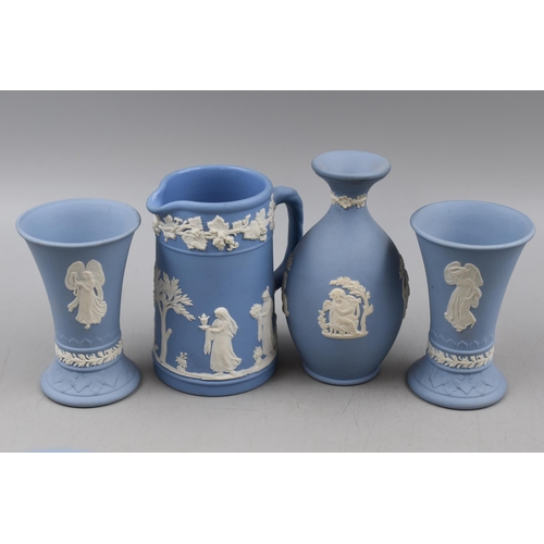 425 - A Selection of Fourteen Wedgwood Jasperware Ornaments. Includes Vases, Jug, Bells and Candle Holder