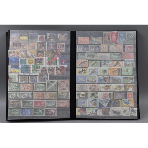 450 - Stanley Gibbons Album Containing a Large Selection of Stamps From New Zealand, Isle of Man and Guern... 