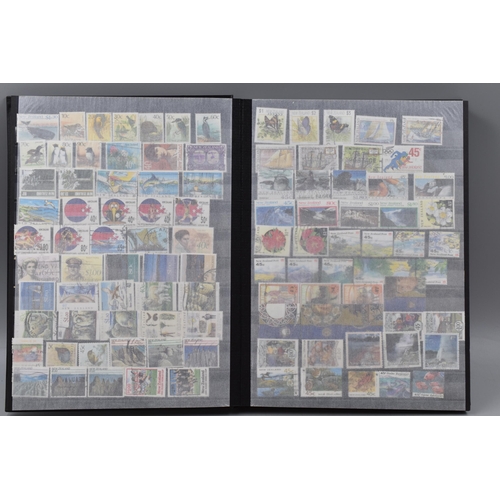 450 - Stanley Gibbons Album Containing a Large Selection of Stamps From New Zealand, Isle of Man and Guern... 