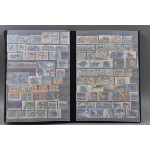 450 - Stanley Gibbons Album Containing a Large Selection of Stamps From New Zealand, Isle of Man and Guern... 