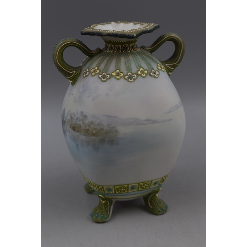 210 - A Noritake Four Dragon Footed Ceramic Two Handled Vase, Depicting Landscape. Approx 7.5