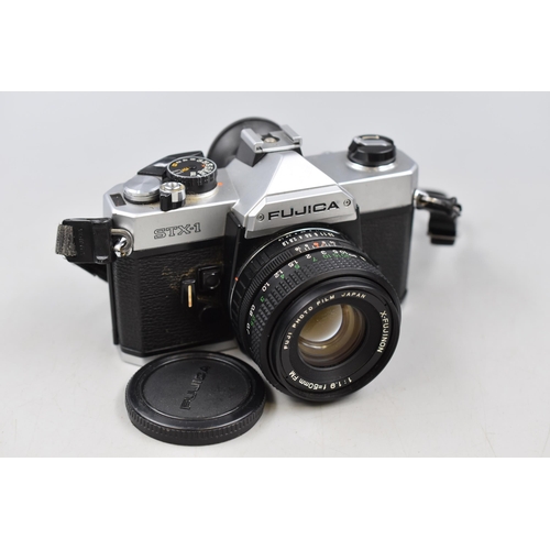 495 - A Fujica STX-1 Camera, With Bag and Accessories. Includes Lenses, Filters, Flash and More.