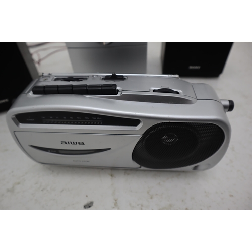 510 - A Sony CD Player/Radio, With Speakers and An Aiwa Cassette Player/Radio. Both Power on When Tested.