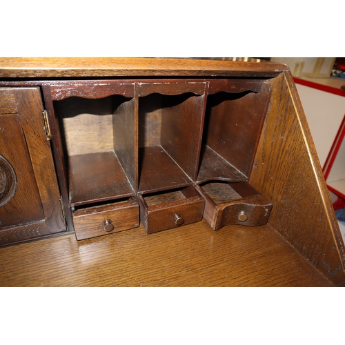 554 - Fine Quality Vintage JC Arts and Crafts Writing Bureau with Hand Carved Coat of Arms and Flower Deco... 