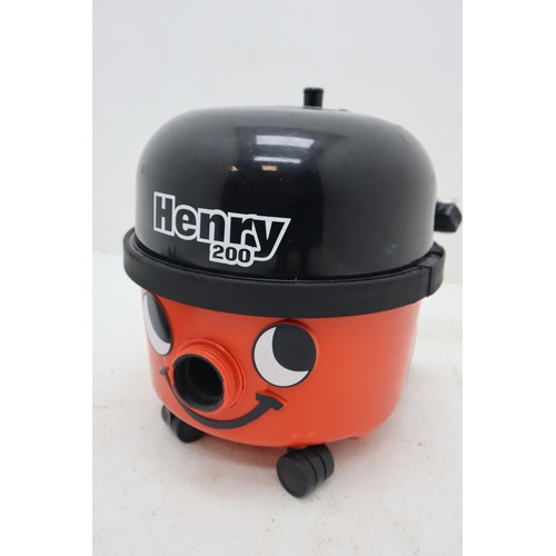 563 - A Henry 200 Vacuum Cleaner, With Accessories. Powers on When Tested.