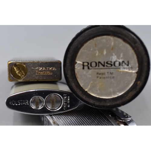 29 - A Selection of Four Vintage Cigarette Lighters, Includes Ronson, Rolstar and Zaima.