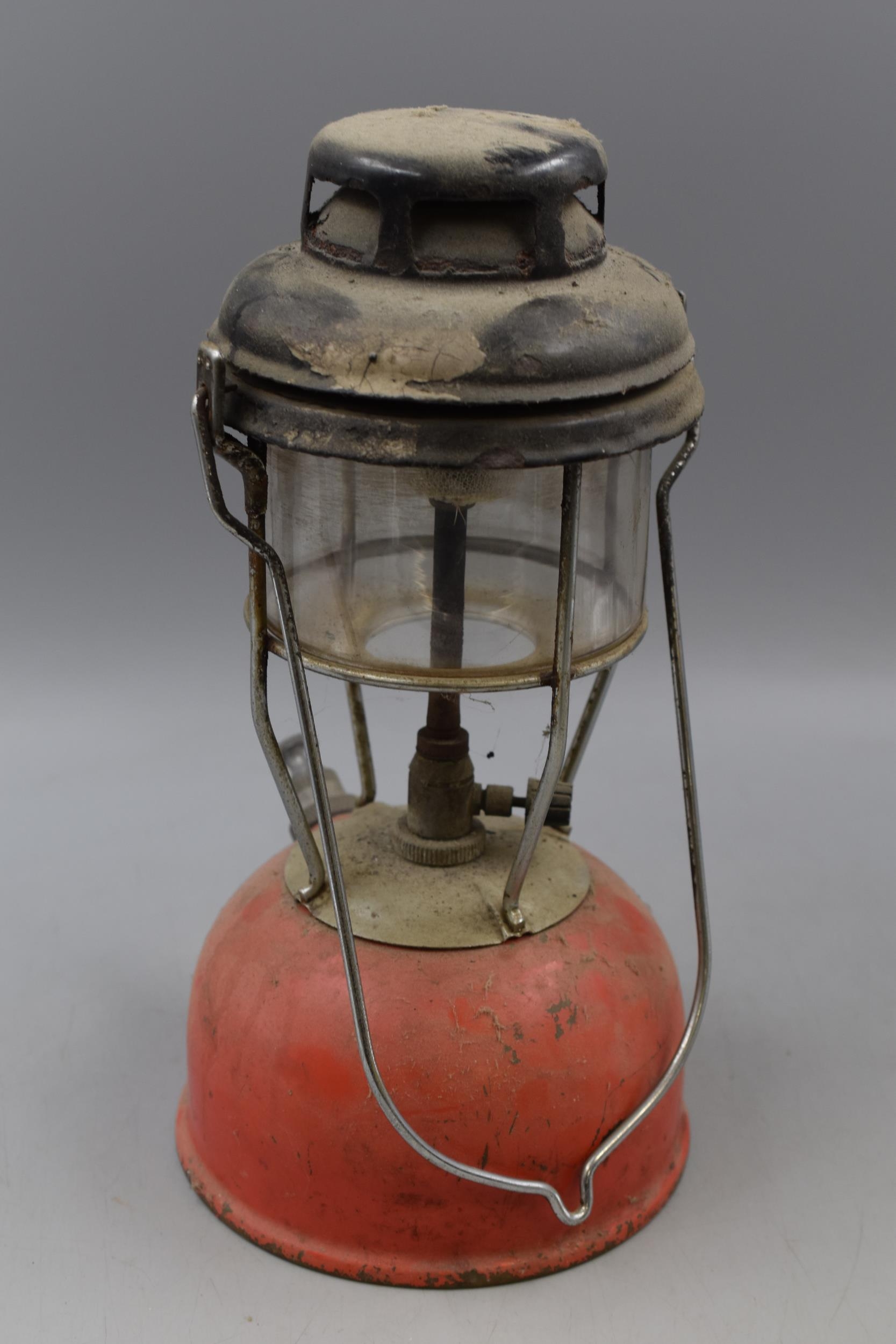 A Vintage Tilley Oil Lamp, In Red. Approx 13" Tall.