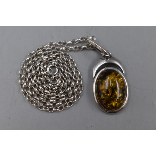 7 - A 925. Silver Amber Pendant on 925. Silver Chain. In Presentation Case.