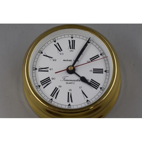 114 - A Boxed Brass Timemaster 'Marine Time' Clock.