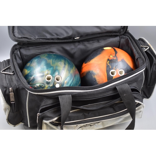 493 - Two Bowling Balls (Ebonite Cyclone and Ebonite Maxim), In Storm Holdall.