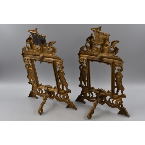 167 - A Pair of Vintage Ornate Cast Iron Picture Frames Depicting Cherubs, With Registered Number. Approx ... 