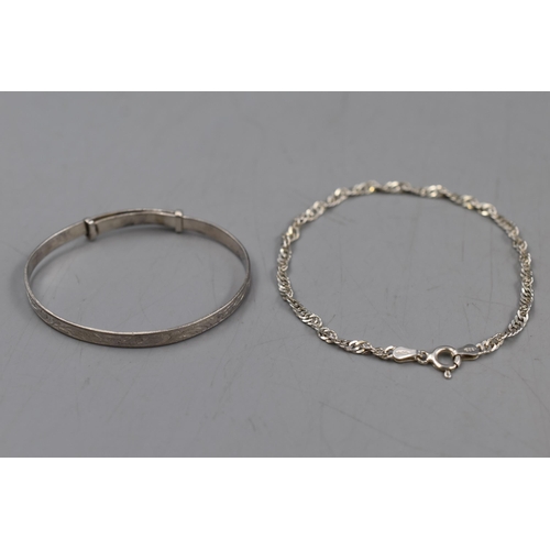 19 - Two Children's Silver Bracelets, Includes 925. Silver Chain Bracelet and Silver Child's Bangle.