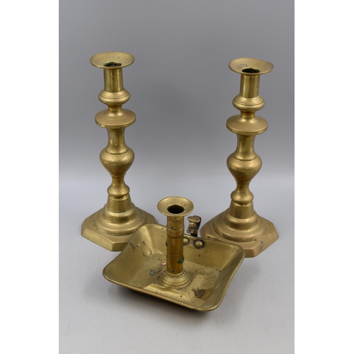 178 - Antique Brass Chamber Stick and a Pair of Matching Candle sticks