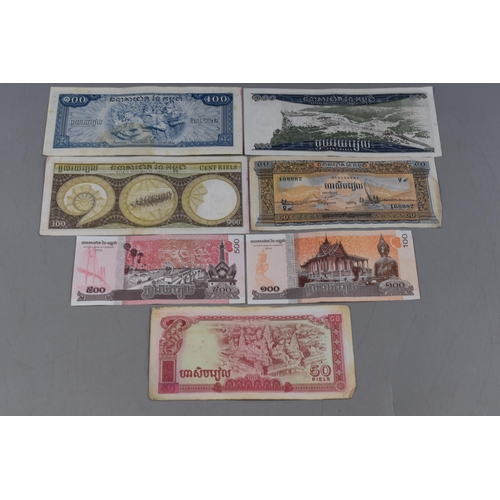 85 - A Selection of Seven Cambodian Banknotes.