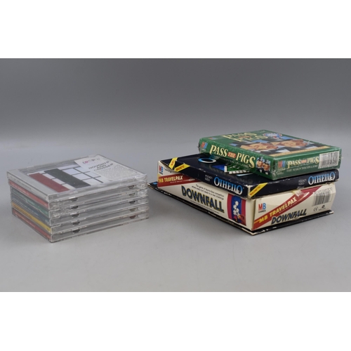 251 - Three MB Pocket Games including Pass the Pigs, Othello, and Downfall together with 6 Compact CD Game... 