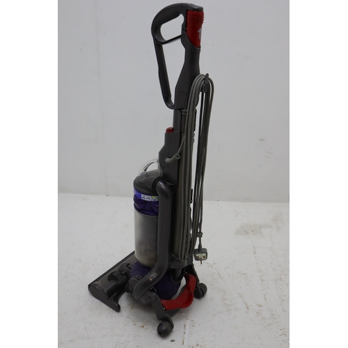 128 - Dyson DC25 Baglass Hoover with Attachments powers on when tested