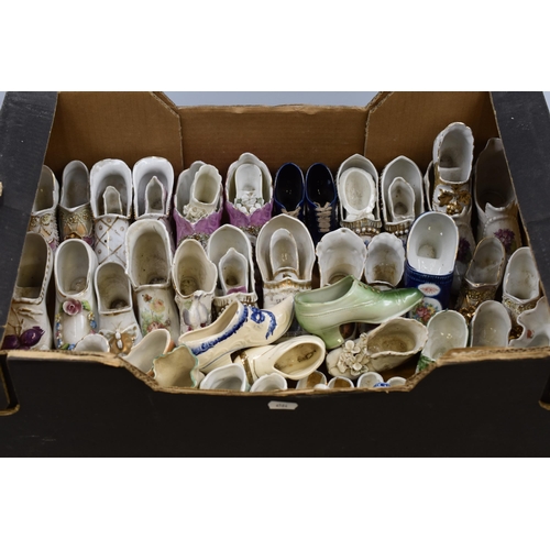 593 - A Large Selection of Assorted Ceramic Shoes.