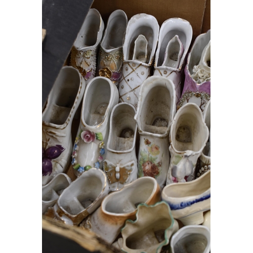 593 - A Large Selection of Assorted Ceramic Shoes.