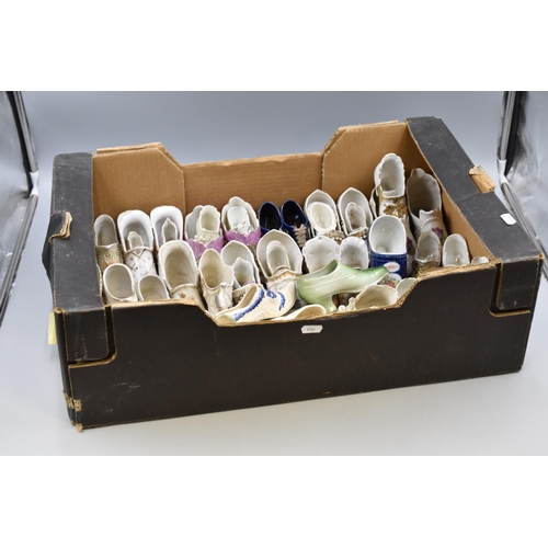 593 - A Large Selection of Assorted Ceramic Shoes.