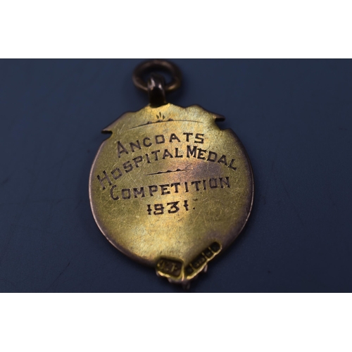 9 - A 9ct Gold Watch Fob, Marked 'Ancoats Hospital Medal; Competiton 1931'.