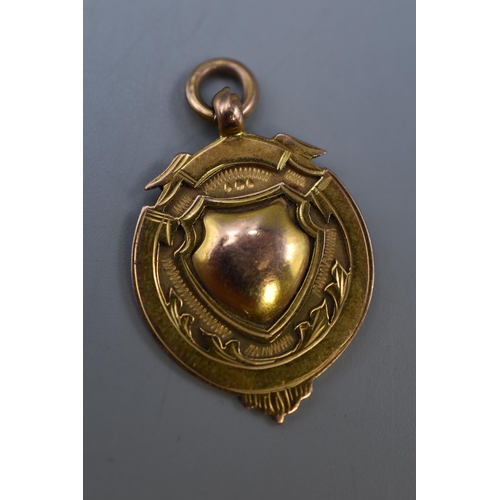 9 - A 9ct Gold Watch Fob, Marked 'Ancoats Hospital Medal; Competiton 1931'.