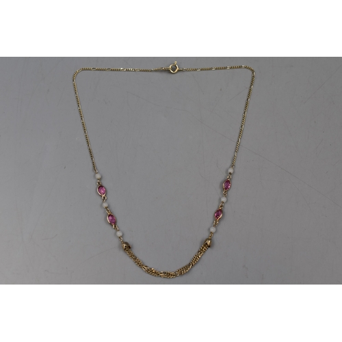 10 - A Silver Pink and Opaque Stoned Necklace.