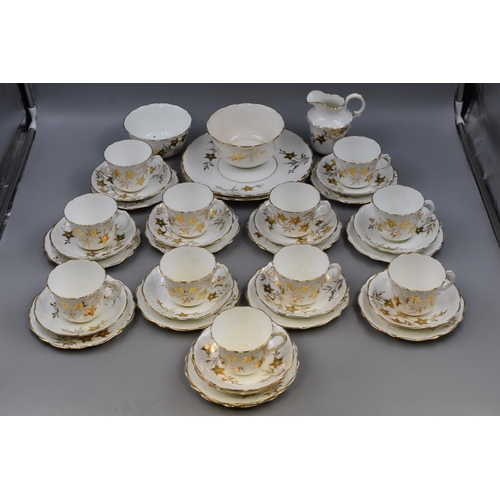 231 - A Forty Piece White and Gold Floral Tea Set. Includes Cups, Saucers, Side Plates, Sugar Bowls, Milk ... 