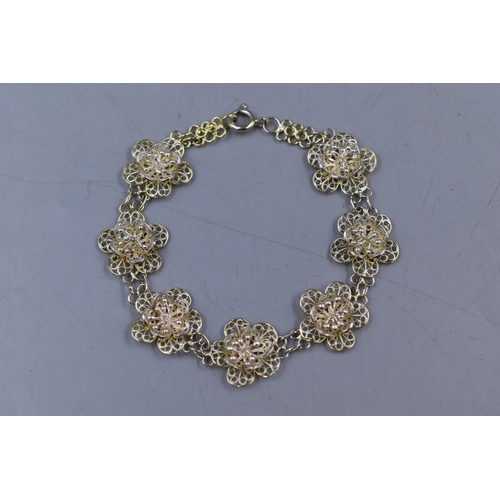 31 - A 925. Silver Filagree Floral Bracelet.