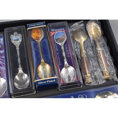 35 - A Selection of Eleven Collector's Teaspoons.