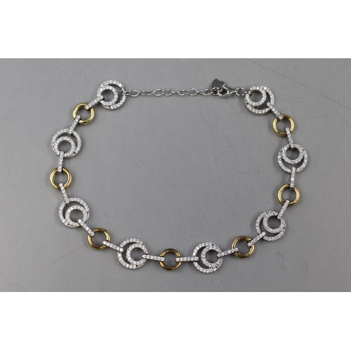 47 - A 925. Silver Gold Tone and Clear Stoned Bracelet.