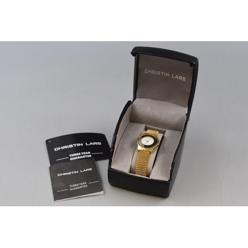 49 - A Christin Lars Gold Tone Water Resistant Watch, In Presentation Box.