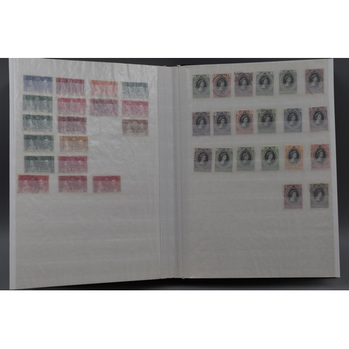 312 - Stock Album Containing a selection of Commonwealth Stamps of George VI